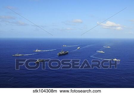 Ships from the Ronald Reagan Carrier Strike Group transit the Pacific Ocean. View Large Photo Image Picture - Ships from the Ronald Reagan Carrier Strike Group transit the Pacific Ocean.. Fotosearch