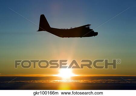 Silhouette of a MC-130H Combat Talon against a setting sun over East Anglia, UK. View Large Photo Image Picture - Silhouette of a MC-130H Combat Talon against a setting sun over East Anglia, UK.. Fotosearch