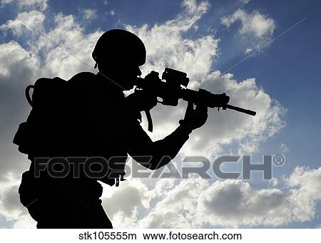 Silhouette of a soldier against a cloudy sky. View Large Photo Image Picture - Silhouette of a soldier against a cloudy sky.. Fotosearch