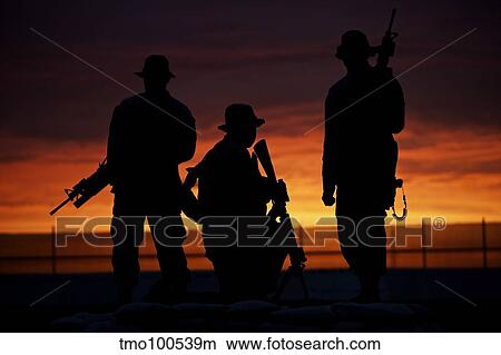 Silhouette of U. S Marines on a bunker at sunset in Afghanistan. View Large Photo Image Picture - Silhouette of U. S Marines on a bunker at sunset in Afghanistan.. Fotosearch