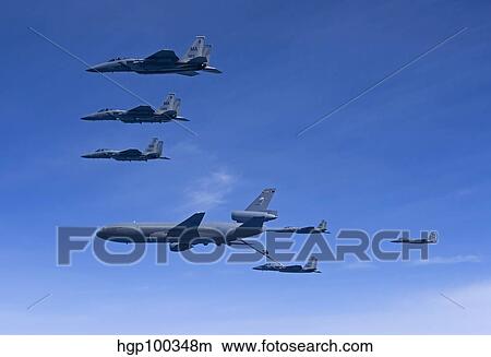 Six F-15 Eagles refuel from a KC-10 Extender. View Large Photo Image Picture - Six F-15 Eagles refuel from a KC-10 Extender.. Fotosearch
