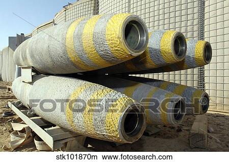 Six GBU-12 bombs sit in a rack inside a weapons storage area. View Large Photo Image Picture - Six GBU-12 bombs sit in a rack inside a weapons storage area.. Fotosearch