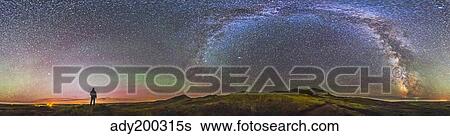 Skygazer standing under the stars at Grasslands National Park, Canada. View Large Photo Image Stock Photograph - Skygazer standing under the stars at Grasslands National Park, Canada.. Fotosearch