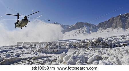 Snow flies up as a U. S. Army CH-47 Chinook prepares to land. View Large Photo Image Picture - Snow flies up as a U. S. Army CH-47 Chinook prepares to land.. Fotosearch