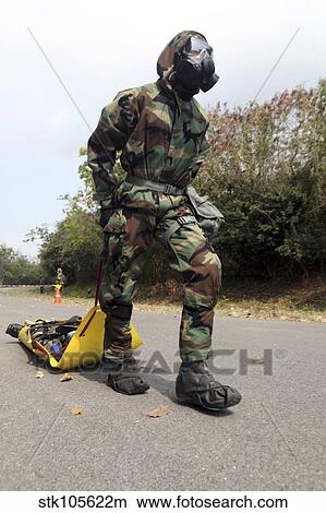 Soldier drags a simulated attack victim during a training exercise. View Large Photo Image Picture - Soldier drags a simulated attack victim during a training exercise.. Fotosearch