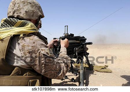 Picture - Soldier fires the Mk. 19 grenade launcher.. Fotosearch