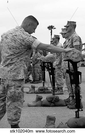 Soldier pays his respect to fallen Marines. View Large Photo Image Picture - Soldier pays his respect to fallen Marines.. Fotosearch
