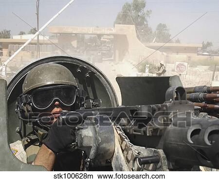 Soldier pulls security from the hatch of a M113 Armored Personnel Carrier. View Large Photo Image Picture - Soldier pulls security from the hatch of a M113 Armored Personnel Carrier.. Fotosearch