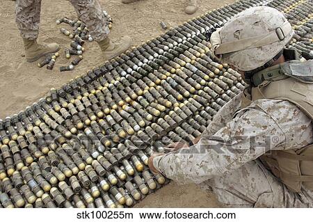 Soldiers arrange all the ordnance confiscated from caches into one big pile to be exploded. View Large Photo Image Picture - Soldiers arrange all the ordnance confiscated from caches into one big pile to be exploded.. Fotosearch