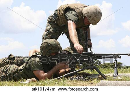 Soldiers fire a M240G medium machine gun. View Large Photo Image Picture - Soldiers fire a M240G medium machine gun.. Fotosearch