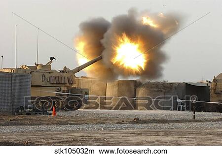 Picture - Soldiers fire the howitzers on their M109A6 Paladins.. Fotosearch