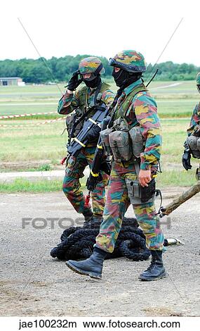 Soldiers of the Special Forces Group and a sniper of the Belgian Army. View Large Photo Image Picture - Soldiers of the Special Forces Group and a sniper of the Belgian Army.. Fotosearch