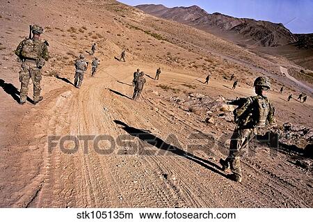 Soldiers patrol to a village in the district of Mizan, Afghanistan. View Large Photo Image Picture - Soldiers patrol to a village in the district of Mizan, Afghanistan.. Fotosearch