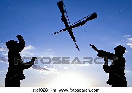 Soldiers practice an over-the-head rifle toss. View Large Photo Image Picture - Soldiers practice an over-the-head rifle toss.. Fotosearch