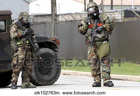 Soldiers stand guard at an intersection during a bomb threat. View Large Photo Image Picture - Soldiers stand guard at an intersection during a bomb threat.. Fotosearch
