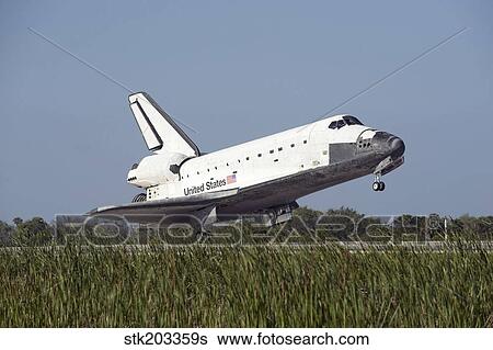 Space shuttle Atlantis touches down on Runway 33 at the Kennedy Space Center in Florida. View Large Photo Image Stock Photograph - Space shuttle Atlantis touches down on Runway 33 at the Kennedy Space Center in Florida.. Fotosearch