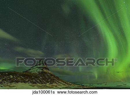 Spectacular northern lights over Mount Kirkjufell in Iceland. View Large Photo Image Stock Photograph - Spectacular northern lights over Mount Kirkjufell in Iceland.. Fotosearch