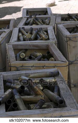 Spent. 50-caliber machine gun shell casings sit inside wooden boxes. View Large Photo Image Picture - Spent. 50-caliber machine gun shell casings sit inside wooden boxes.. Fotosearch