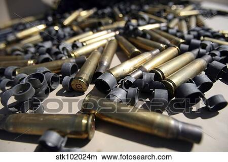 Spent brass and disintegrated links. View Large Photo Image Picture - Spent brass and disintegrated links.. Fotosearch