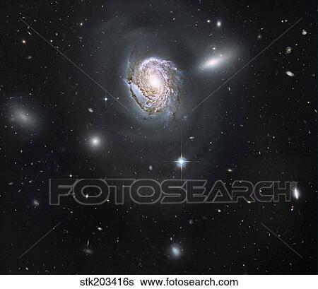Spiral galaxy NGC 4911 located deep within the Coma Cluster of galaxies. View Large Photo Image Stock Photograph - Spiral galaxy NGC 4911 located deep within the Coma Cluster of galaxies.. Fotosearch