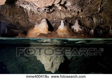 Split shot of stalactites and stalagmites in a cave, Australia. View Large Photo Image Stock Photograph - Split shot of stalactites and stalagmites in a cave, Australia.. Fotosearch