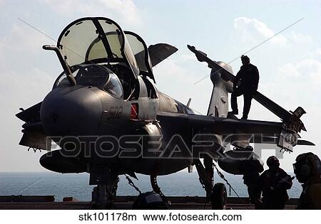 Squadron personnel prepare an EA-6B Prowler for flight operations. View Large Photo Image Picture - Squadron personnel prepare an EA-6B Prowler for flight operations.. Fotosearch