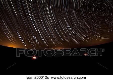 Star trails above a dark Maranjab Desert, Iran. View Large Photo Image Stock Photograph - Star trails above a dark Maranjab Desert, Iran.. Fotosearch