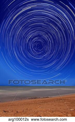 Star trails around the south celestial pole at the beach in Miramar, Argentina. View Large Photo Image Stock Photograph - Star trails around the south celestial pole at the beach in Miramar, Argentina.. Fotosearch