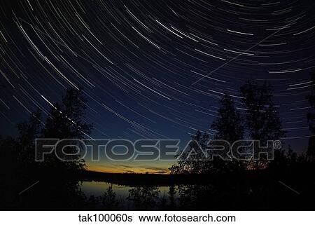 Star trails at dusk. View Large Photo Image Stock Photograph - Star trails at dusk.. Fotosearch