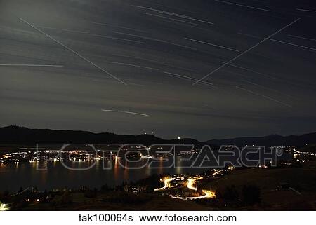 Star trails over Okanagan Lake, Vernon, British Columbia, Canada. View Large Photo Image Stock Photograph - Star trails over Okanagan Lake, Vernon, British Columbia, Canada.. Fotosearch