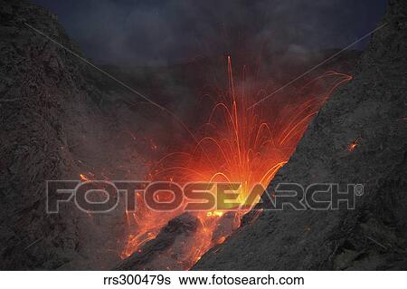 Stock Photograph - Strombolian type eruption of Batu Tara volcano, Indonesia.. Fotosearch