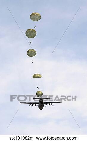 Students jump from a C-130 Hercules. View Large Photo Image Picture - Students jump from a C-130 Hercules.. Fotosearch