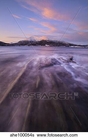 Stock Photograph - Sunrise over Tjeldsundet in Troms County, Norway.. Fotosearch