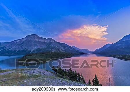 Sunset at Waterton Lakes National Park, Alberta, Canada. View Large Photo Image Stock Photograph - Sunset at Waterton Lakes National Park, Alberta, Canada.. Fotosearch