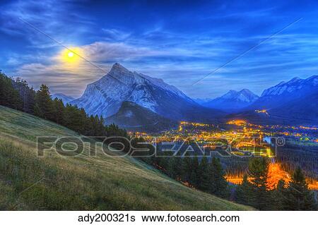 Supermoon rising over Mount Rundle and Banff townsite in Canada. View Large Photo Image Stock Photograph - Supermoon rising over Mount Rundle and Banff townsite in Canada.. Fotosearch