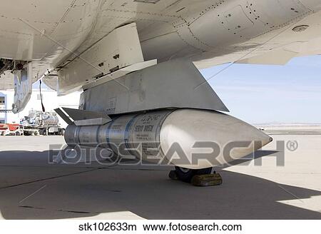 Picture - Surplus Navy Phoenix missiles mounted on the centerline pylon of NASA's F-15B research aircraft.. Fotosearch
