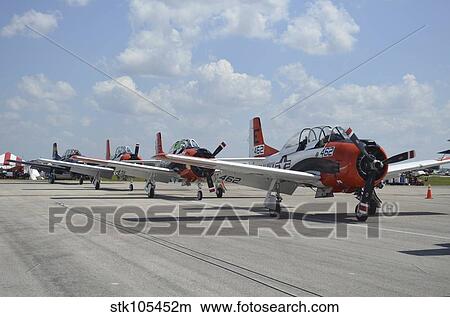 T-28C Trojan aircraft lined up on the flight line. View Large Photo Image Picture - T-28C Trojan aircraft lined up on the flight line.. Fotosearch