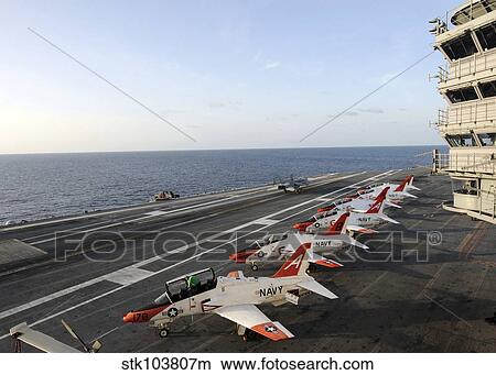 T-45C Goshawk training aircraft line the flight deck aboard the aircraft carrier USS George H. W. Bush. View Large Photo Image Picture - T-45C Goshawk training aircraft line the flight deck aboard the aircraft carrier USS George H. W. Bush.. Fotosearch