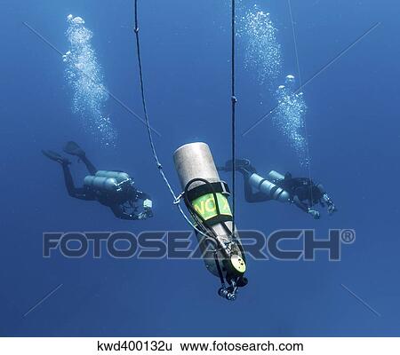 Technical divers ascend near a Nitrox stage bottle View Large Photo Image Stock Photograph - Technical divers ascend near a Nitrox stage bottle. Fotosearch