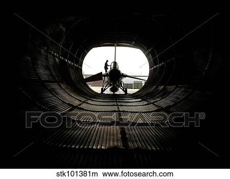 Technician prepares an F-16 Fighting Falcon. View Large Photo Image Picture - Technician prepares an F-16 Fighting Falcon.. Fotosearch