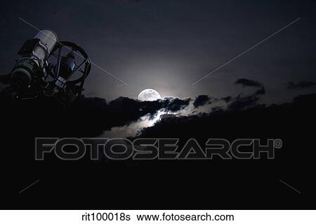 Telescope pointed out to the night sky with moon and clouds. View Large Photo Image Stock Photograph - Telescope pointed out to the night sky with moon and clouds.. Fotosearch