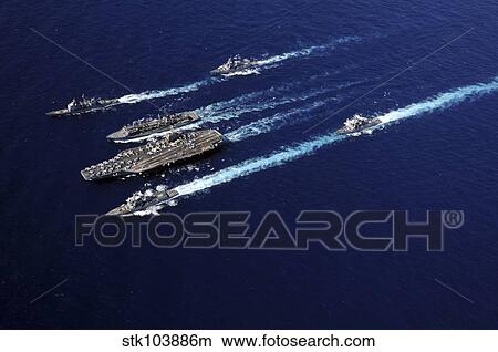 The Abraham Lincoln Carrier Strike Group ships cruise in formation in the Pacific Ocean. View Large Photo Image Picture - The Abraham Lincoln Carrier Strike Group ships cruise in formation in the Pacific Ocean.. Fotosearch