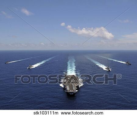 The aircraft carrier USS Abraham Lincoln leading a formation of ships from the Abraham Lincoln Strike Group. View Large Photo Image Picture - The aircraft carrier USS Abraham Lincoln leading a formation of ships from the Abraham Lincoln Strike Group. . Fotosearch