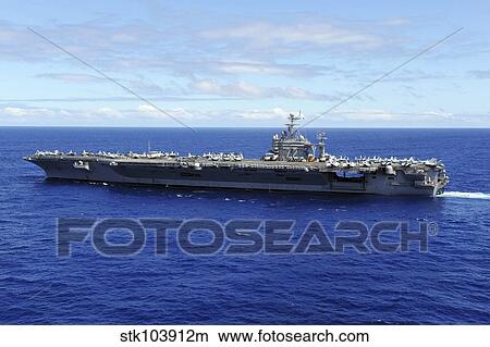 The aircraft carrier USS Abraham Lincoln transits across the Pacific Ocean. View Large Photo Image Picture - The aircraft carrier USS Abraham Lincoln transits across the Pacific Ocean.. Fotosearch
