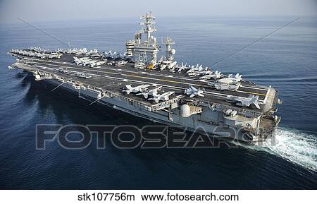 The aircraft carrier USS Nimitz is underway in the Arabian Gulf. View Large Photo Image Picture - The aircraft carrier USS Nimitz is underway in the Arabian Gulf.. Fotosearch