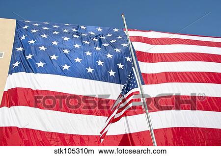 The American flag hangs over a headquarters building in Afghanistan. View Large Photo Image Picture - The American flag hangs over a headquarters building in Afghanistan.. Fotosearch