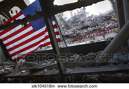 The American Flag is prominent amongst the rubble of what was once the World Trade Center. View Large Photo Image Picture - The American Flag is prominent amongst the rubble of what was once the World Trade Center.. Fotosearch