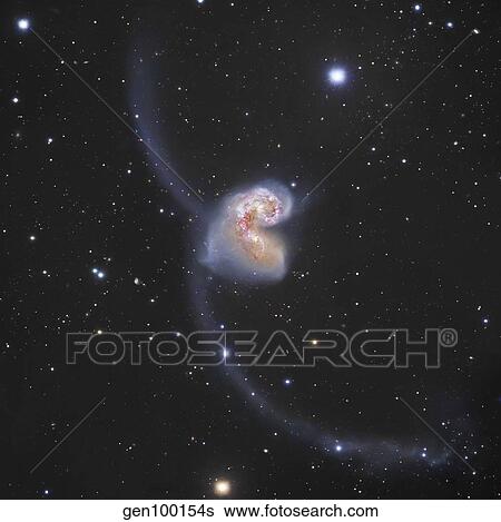 The Antennae Galaxies in the constellation Corvus. View Large Photo Image Stock Photograph - The Antennae Galaxies in the constellation Corvus.. Fotosearch