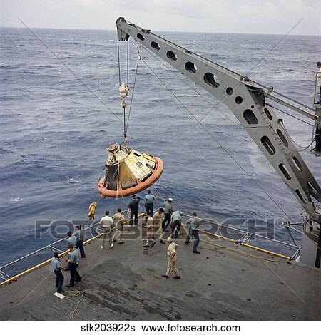 The Apollo Spacecraft command module is recovered aboard USS Bennington. View Large Photo Image Stock Photograph - The Apollo Spacecraft command module is recovered aboard USS Bennington.. Fotosearch