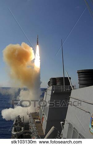 The Arleigh Burke-class guided missile destroyer USS Stout launching a SM-2 Standard Missile. View Large Photo Image Picture - The Arleigh Burke-class guided missile destroyer USS Stout launching a SM-2 Standard Missile. . Fotosearch